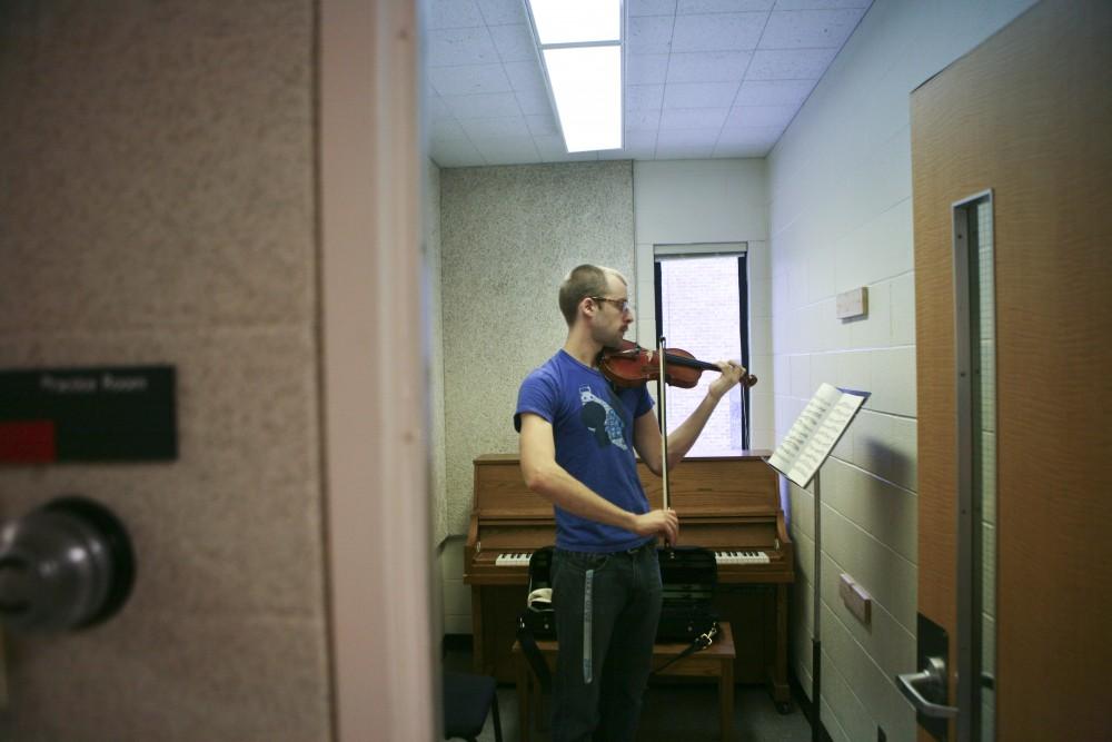 Sophomore Steven Borg uses the practice rooms in the Performin Arts Center. The number of rooms are limited, sometimes making it difficult for students to practice.