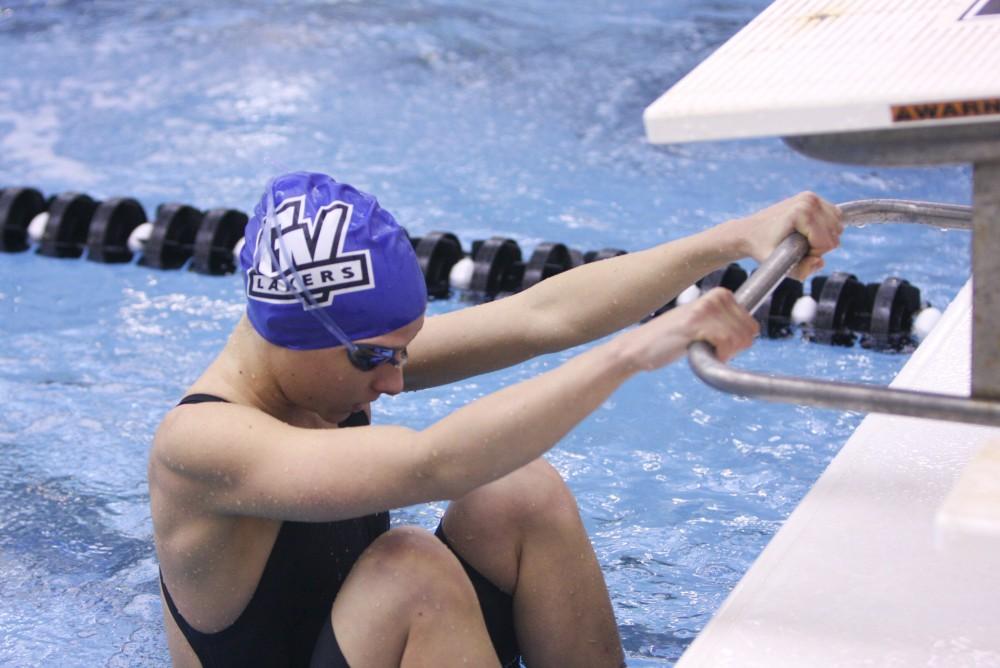 Sophomore Marissa Orr prepares to backstroke during the GLIAC Championship held in Jenison