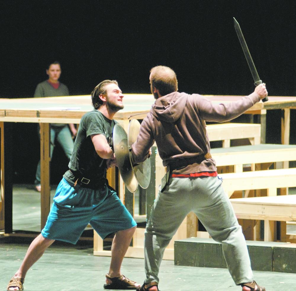 To the death!: Two actors perfect a fight scene for Braggart Soldier, which debuts tomorrow at 7:30 p.m. The play is a modern translation of an ancient Roman comedy.