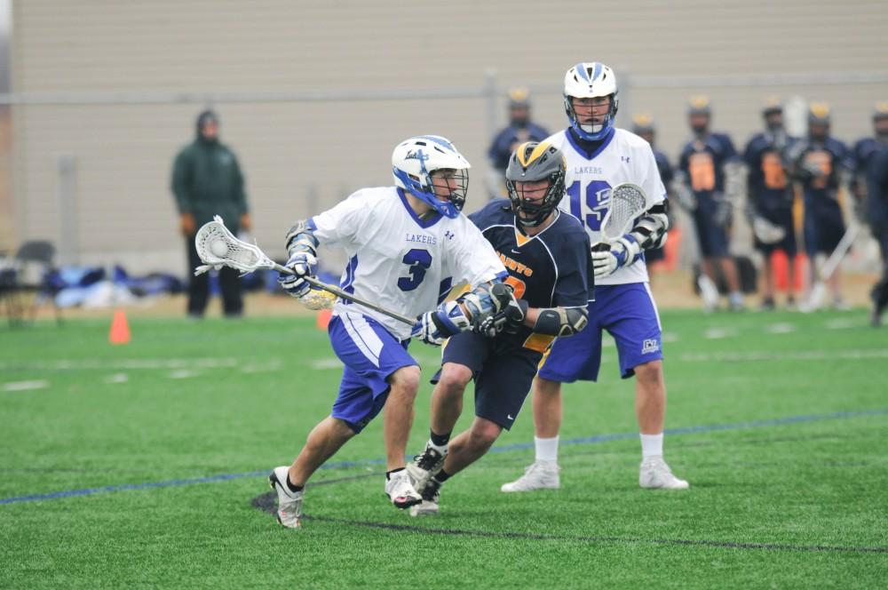 Grand Valley men’s lacrosse player Tyler McCullen plays during Sunday’s home game against Sienna Heights.