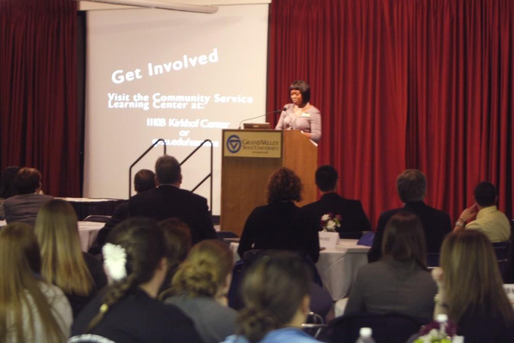 Bunmi Fadase speaks at a ceremony recognizing students who volunteered their time during the president's 50 Hour Service Challenge.