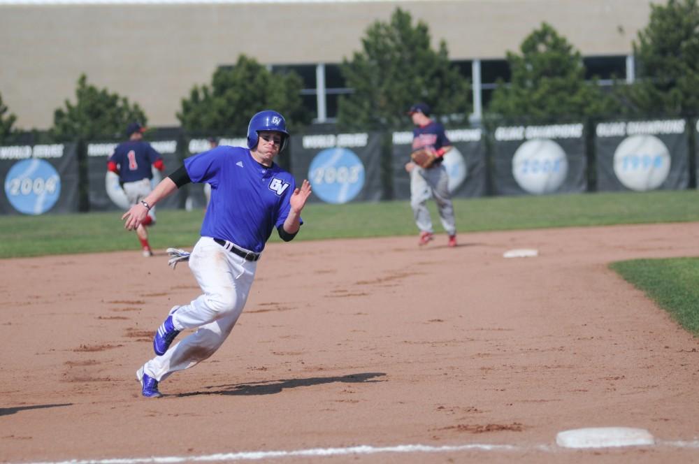 Grand Valley player Paul Young looks to round third on his way to home plate during Saturdays double header. The Lakers split the games with Saginaw Valley.
