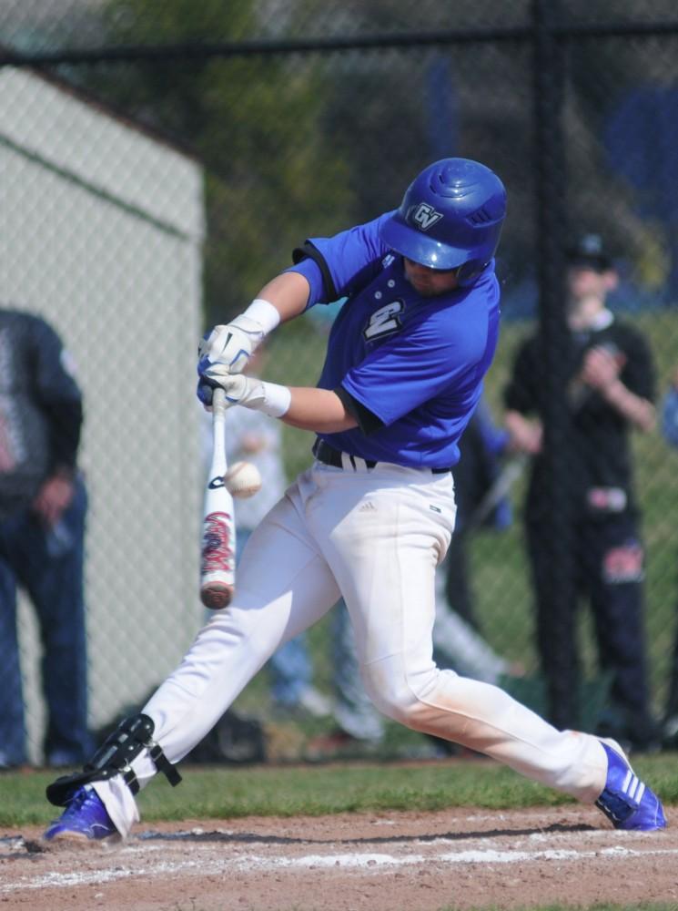 GVL / Andrew MillsGrand Valley second-baseman gets a piece of the ball while batting at home in Allendale