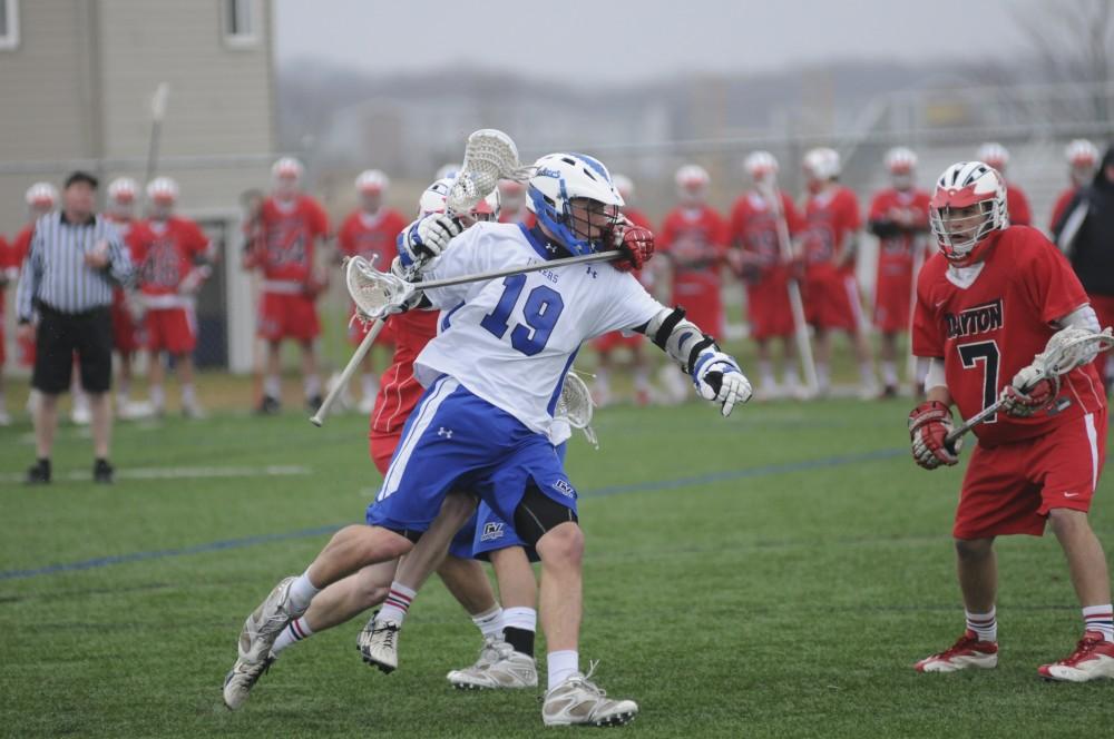 Grand Valley Men’s lacrosse player Cameron Holding plays during Saturday’s home game against rival Dayton University.