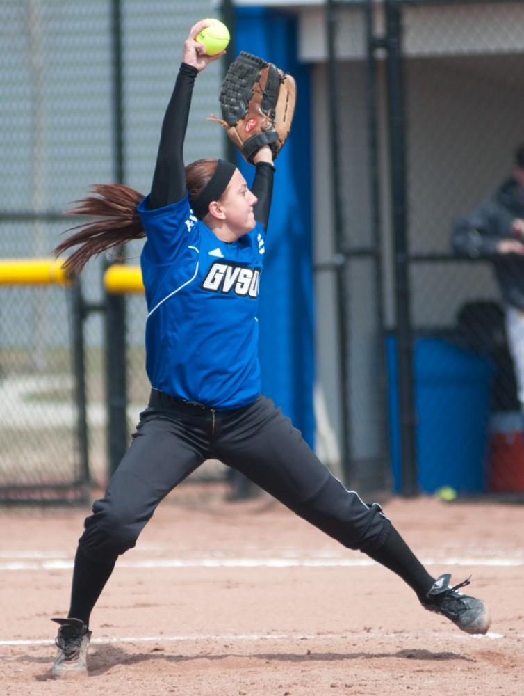 Sophomore pitcher Hannah Santora winds up for a pitch during Saturdays softball game