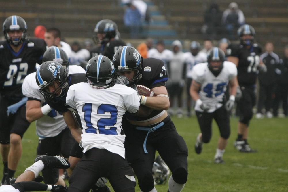 GVL Archive / Brian Sevald
Defense takes down the offense during last years Spring football game