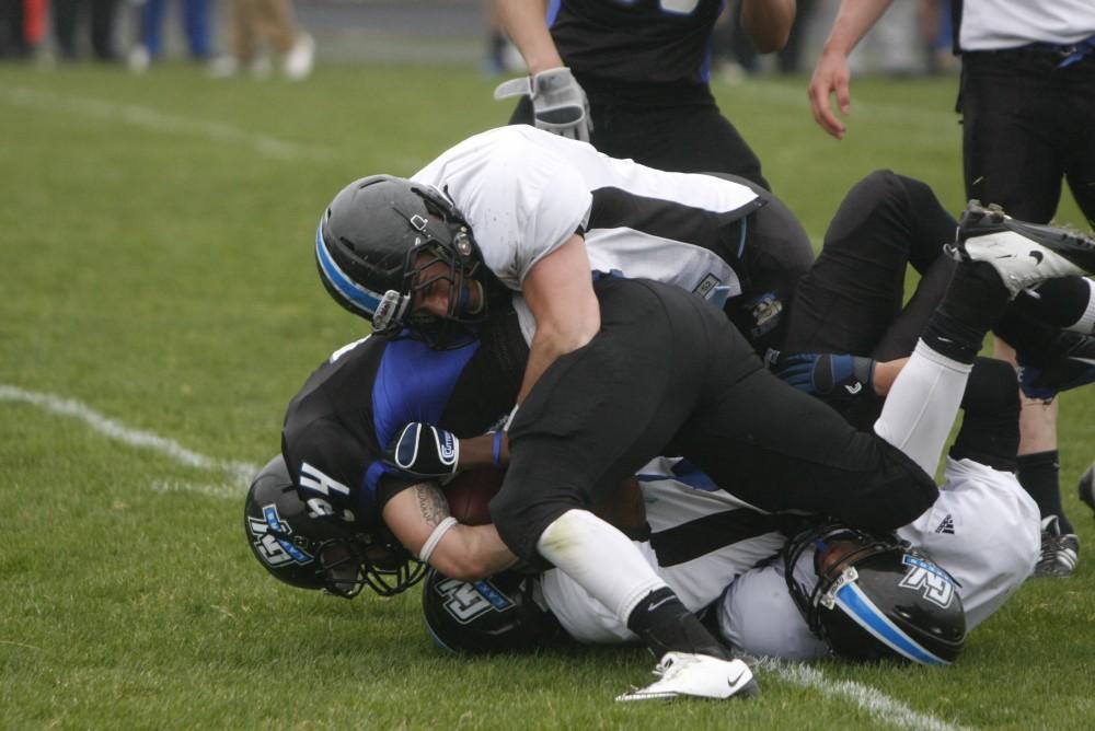 The Laker offense gets taken down by the defense during the spring game this Saturday.