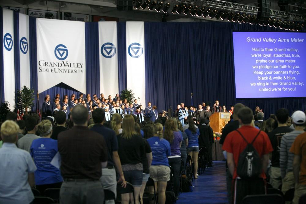 GVL/ Eric Coulter
The audience, led by the University Arts Chorale and the Grand Valley State Brass Quintet, joins in the singing of "Hail to Thee, Grand Valley" at Convocation last Friday.