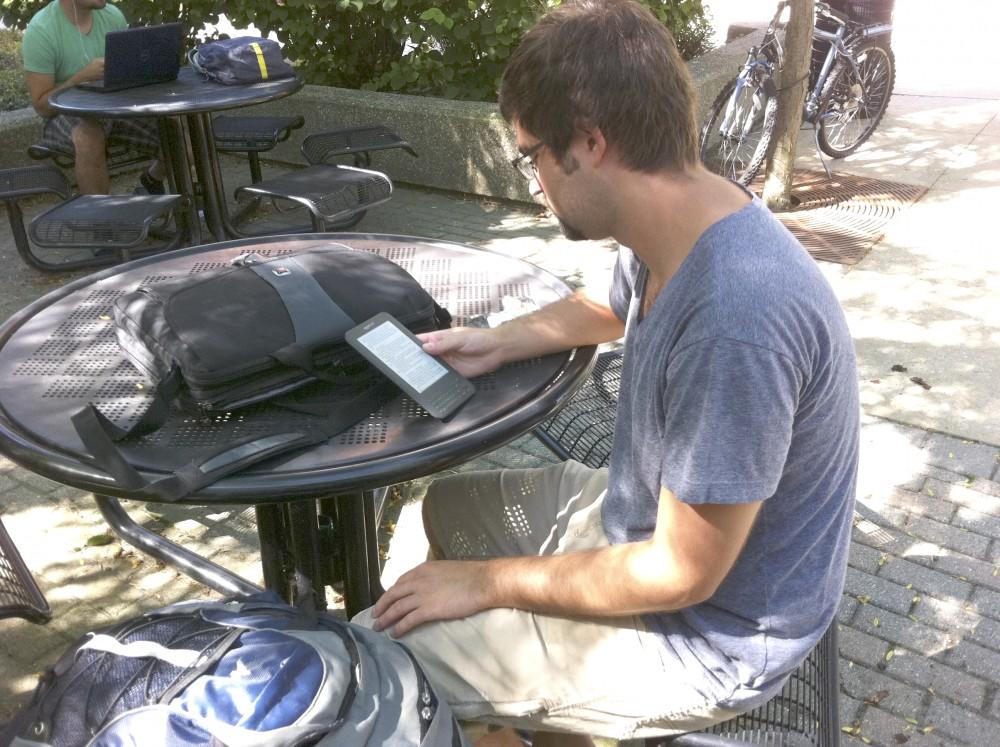 GVL/ Rane Martin
Junior Mitchel Spleet reads an e-book on his Kindle between classes.