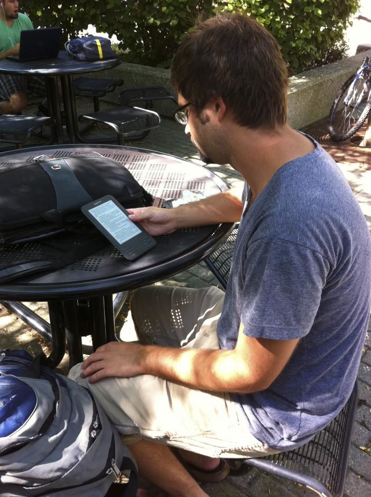 GVL/ Rane Martin
Junior Mitchel Spleet reads an e-book on his Kindle between classes.