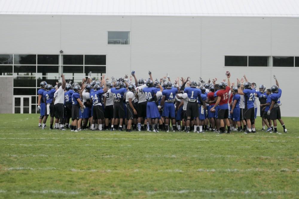 GVL/ Rane Martin
The entire teams preforms a lively chant to get motivated during practice on Tuesday.