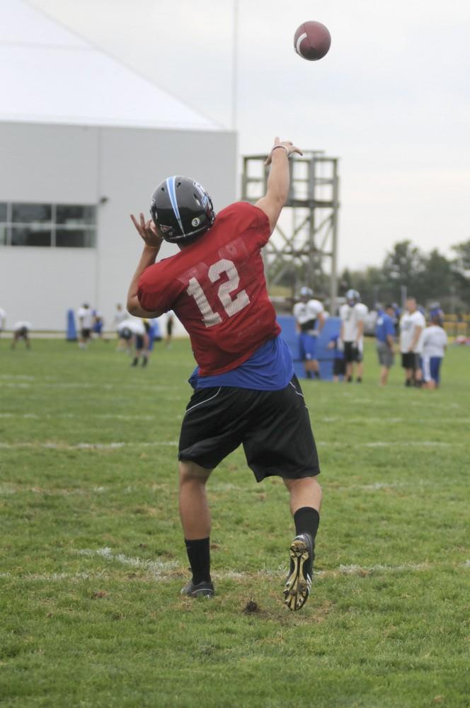 GVL/ Rane Martin
Sophomore quarterback Heath Parling makes a few warm-up throws during practice on Tuesday.