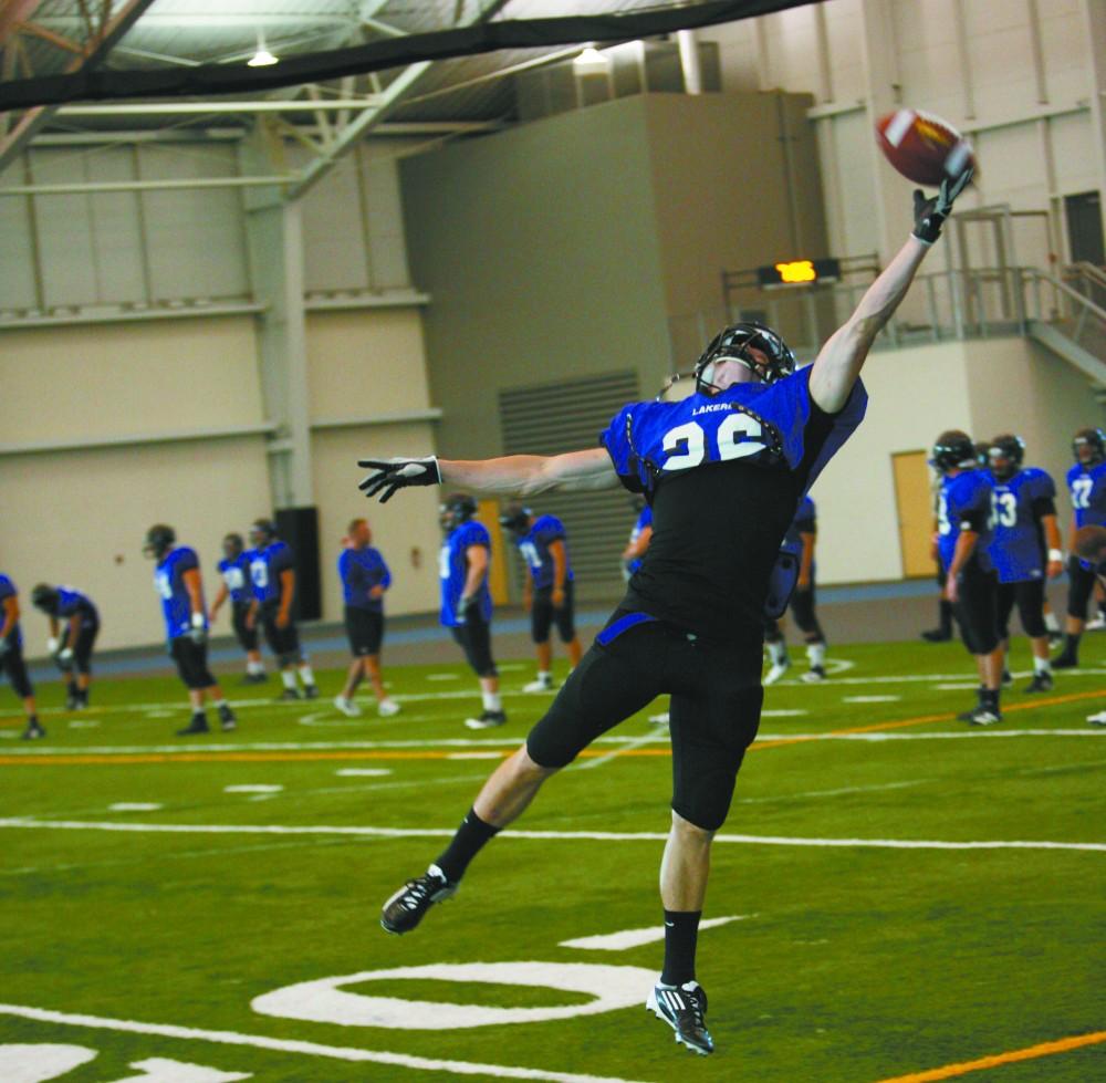 GVL / Eric Coulter
Sophomore Wide Reciever Brandan Green stretches to haul in a ball during practice