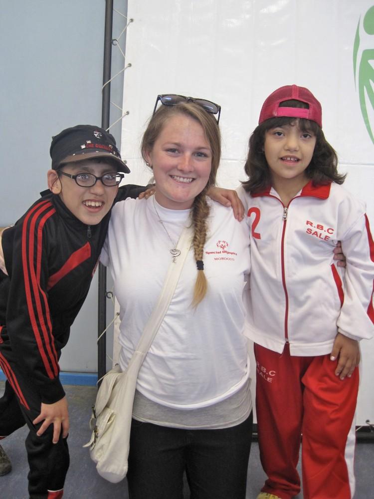 Courtesy Photo/ Janice Laurente
Peace Corp volunteer and GVSU alum Sarah Hollemans spends time with two excited athletes prior to the Special Olympics Opening Ceremonies in Tangier, Morocco.                               