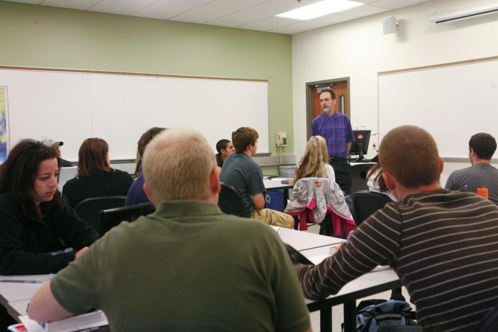 GVL / Eric Coulter
Students listen to Professor Robert Francisoi during the remembering 9/11 presentation, a class offered as an option in the Honors College for junior seminar.