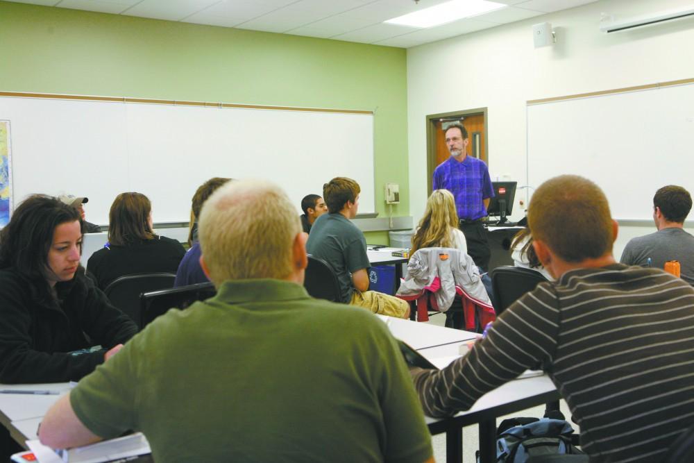 GVL / Eric Coulter
Students listen to Professor Robert Francisoi during the remembering 9/11 presentation, a class offered as an option in the Honors College for junior seminar.