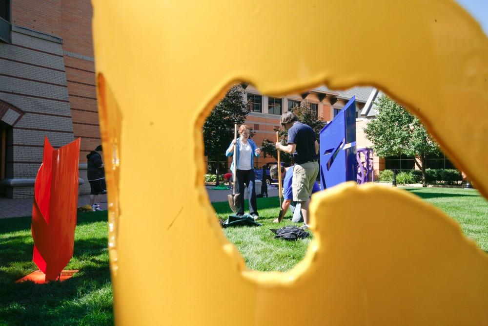 GVL / Eric Coulter
Volunteers help install the work of Black River Public School students that collaborated with Cynthia McKeen and Cyril Lixemburg