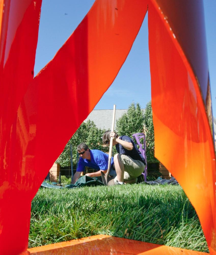 GVL / Eric Coulter
Jessie Belkiewicz volunteered to help install the collaborative art on the downtown Pew campus