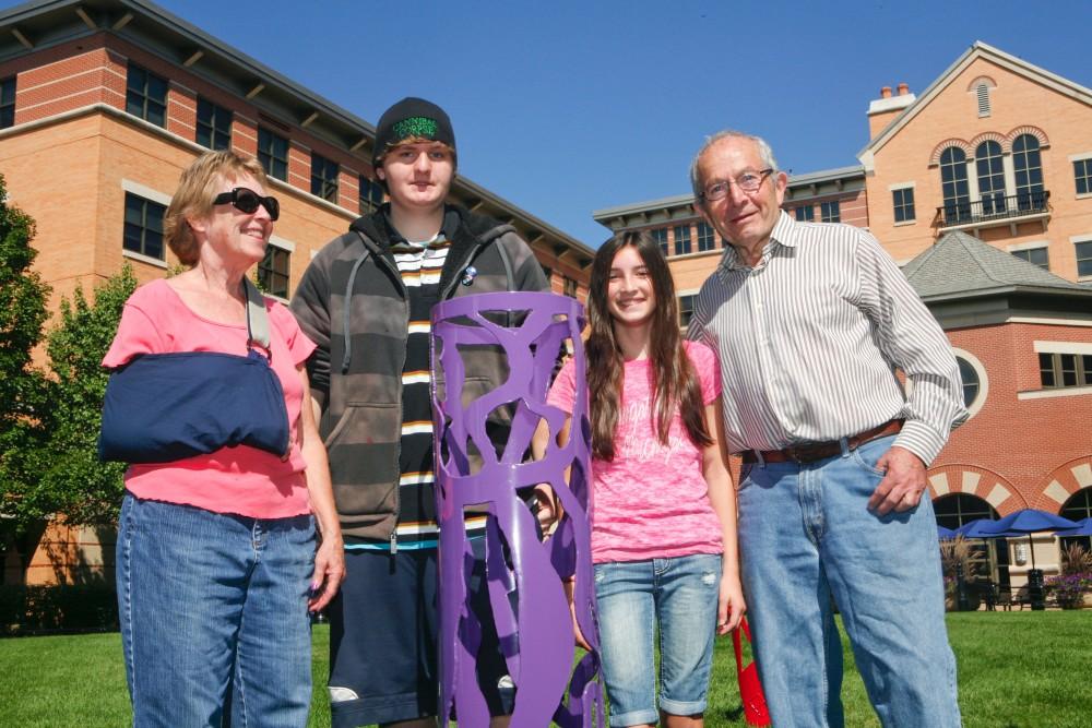 GVL / Eric Coulter
Artists Cynthia McKeen and Cyril Lixemburg stand next to young Black River Public Schools artists Autumn Shipley-Melon and Peter Middleton. The piece pictured with them is a part of a collaboration between select students and McKeen and Lixemburg. 