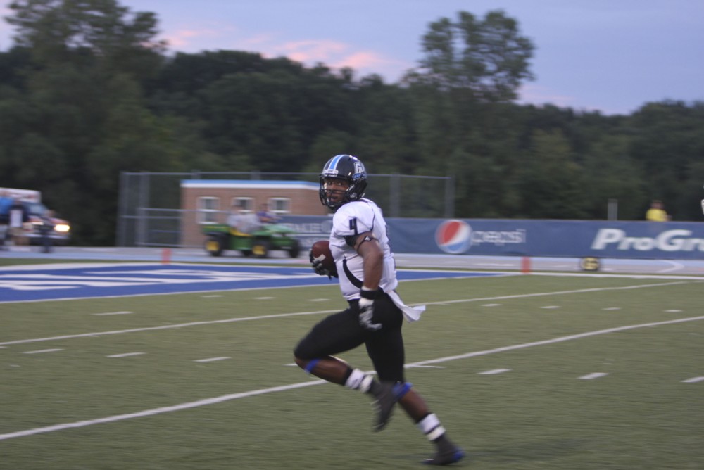 GVL/ Brady Frederickson
Junior wide receiver Charles Johnson hauls in a 71 yard pass late in the second quarter during their away game against Hillsdale on Saturday.