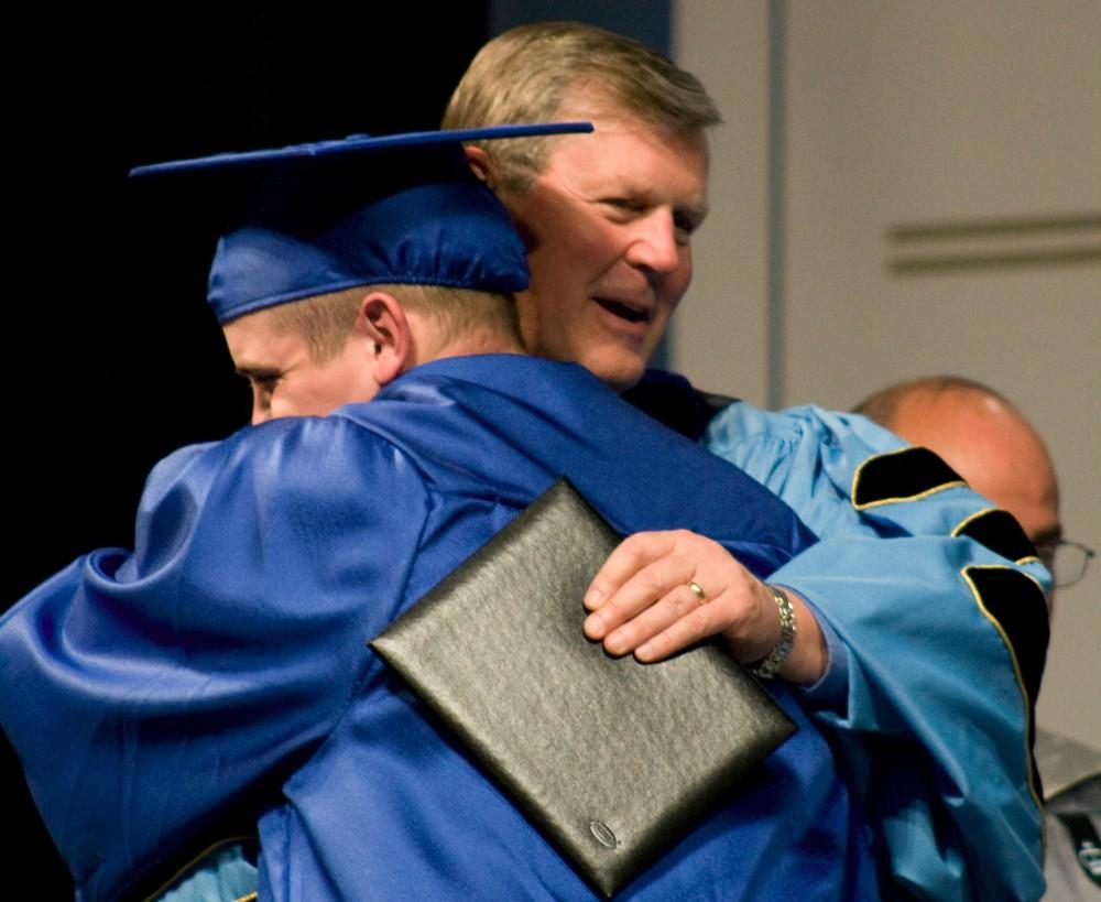 GVL Archive 
President Haas gets a hug from an excited graduate last commencement