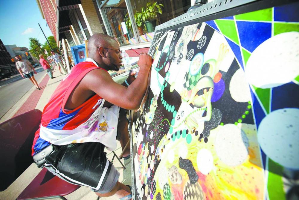 Courtesy Photo /
An artist creates a new piece during The Market, made possible by Avenue for the Arts.