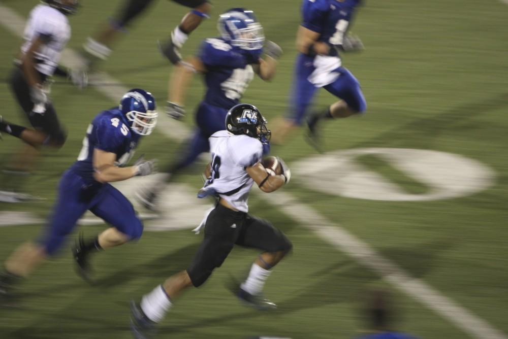 GVL/ Brady Frederickson
Sophomore corner back Reggie Williams takes the kick return towards the endzone during their away game against Hillsdale on Saturday.