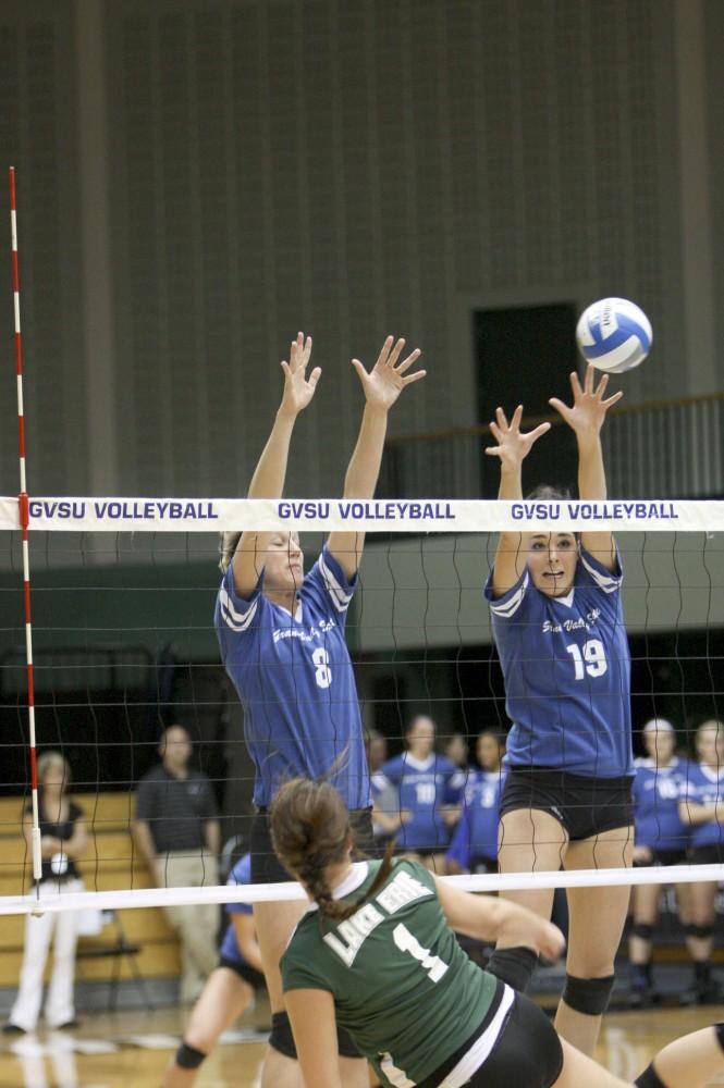 GVL Archive
Senior Nicole Whiddon and freshman Ally Simmons block the spike from their opponent at a past match.