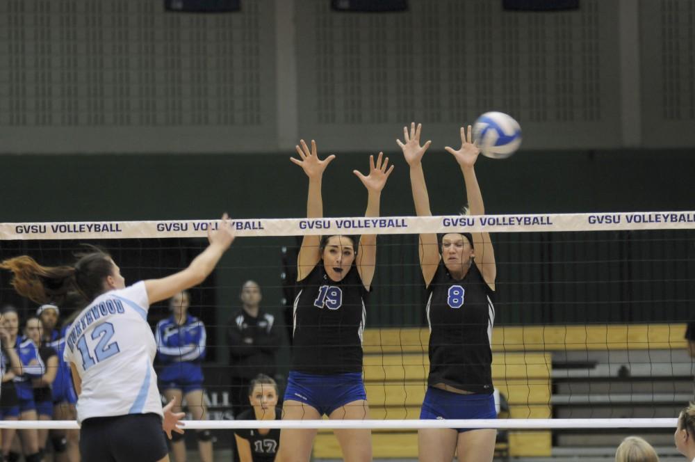GVL Archive
Senior Nicole Whiddon and freshman Ally Simmons block the spike from their opponent at a past match.