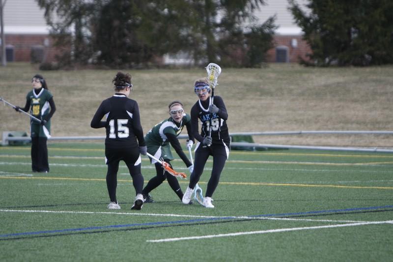 GVL Archive 
The Women's Lacrosse team holds off their opponent during a past match on the Laker Turf Field.