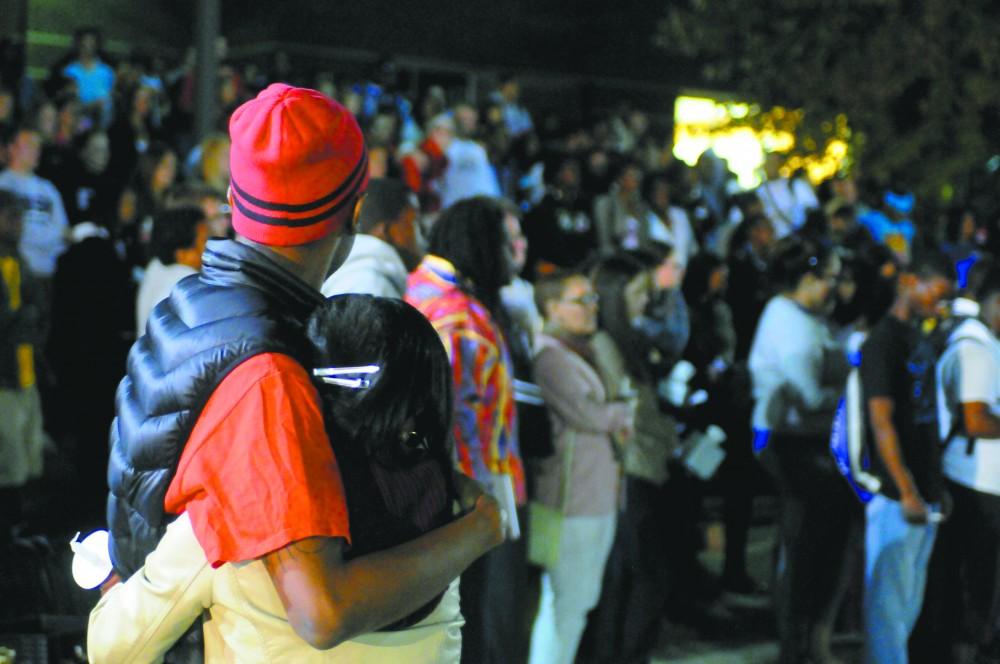 GVL / Eric Coulter
Friends of Shane Welch comfort eachother during the candle lit vigil