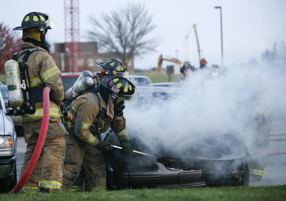 GVL / Eric Coulter
Allendale Fire FIghters responded to a car fire that took place in the parking lot near the Fieldhouse. Grand Valley State Police were unavailable for comment as to the cause of the fire. 