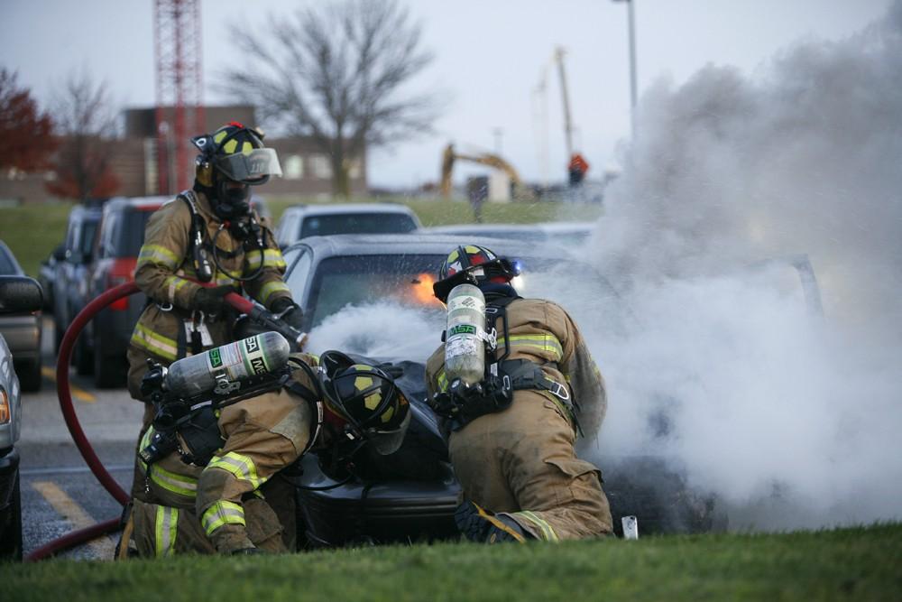 GVL / Eric Coulter
Allendale Fire FIghters responded to a car fire that took place in the parking lot near the Fieldhouse. Grand Valley State Police were unavailable for comment as to the cause of the fire. 