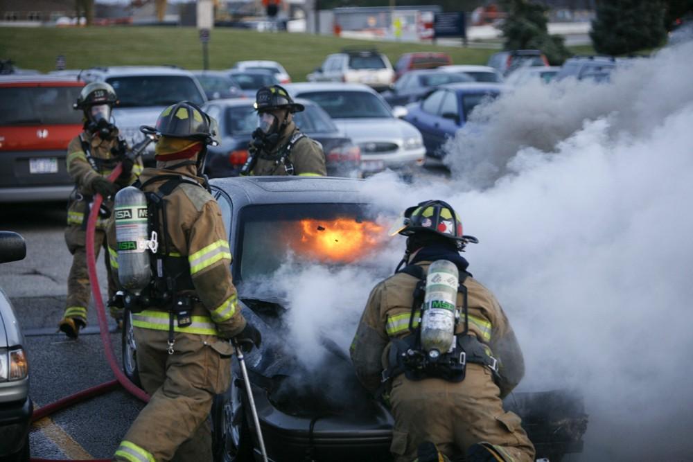 GVL / Eric Coulter
Allendale Fire FIghters responded to a car fire that took place in the parking lot near the Fieldhouse. Grand Valley State Police were unavailable for comment as to the cause of the fire. 