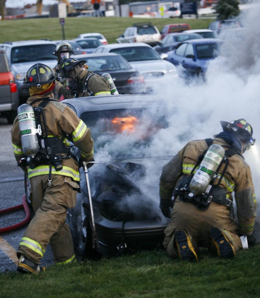 GVL / Eric Coulter
Allendale Fire FIghters responded to a car fire that took place in the parking lot near the Fieldhouse. Grand Valley State Police were unavailable for comment as to the cause of the fire. 