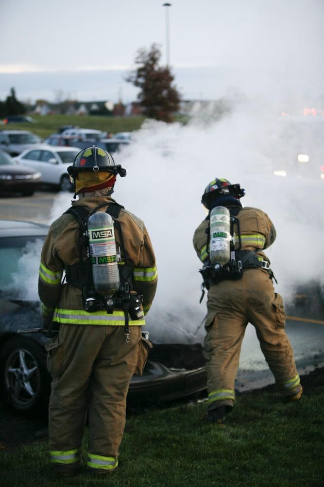 GVL / Eric Coulter
Allendale Fire FIghters responded to a car fire that took place in the parking lot near the Fieldhouse. Grand Valley State Police were unavailable for comment as to the cause of the fire. 