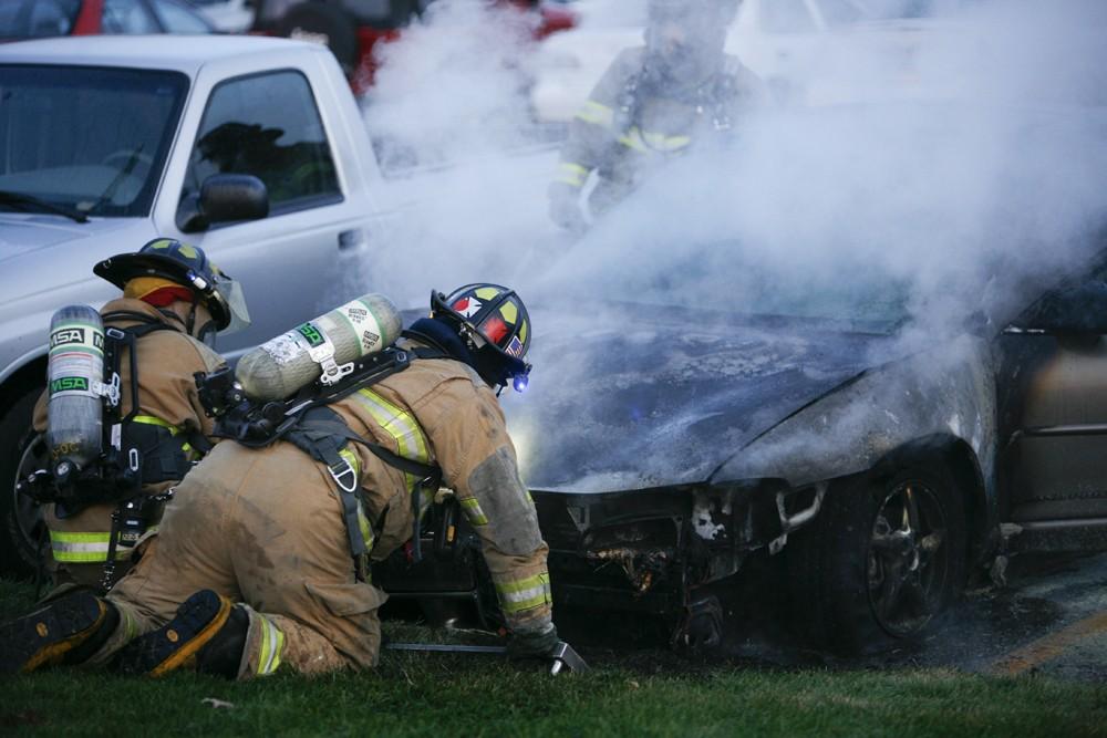 GVL / Eric Coulter
Allendale Fire FIghters responded to a car fire that took place in the parking lot near the Fieldhouse. Grand Valley State Police were unavailable for comment as to the cause of the fire. 