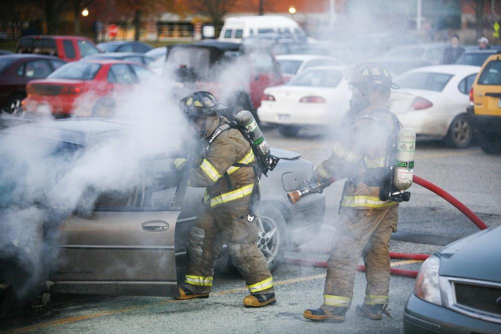 GVL / Eric Coulter
Allendale Fire FIghters responded to a car fire that took place in the parking lot near the Fieldhouse. Grand Valley State Police were unavailable for comment as to the cause of the fire. 