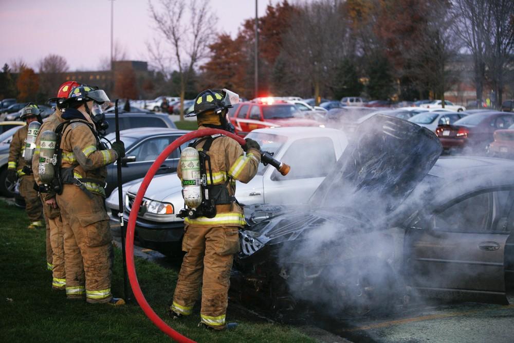 GVL / Eric Coulter
Allendale Fire FIghters responded to a car fire that took place in the parking lot near the Fieldhouse. Grand Valley State Police were unavailable for comment as to the cause of the fire. 