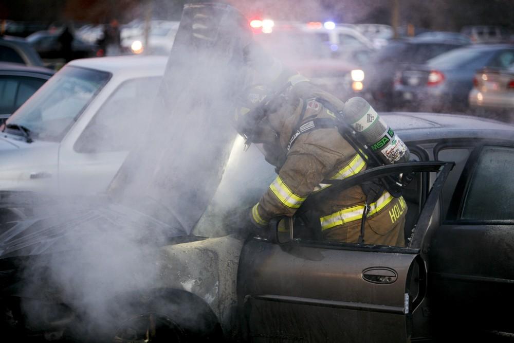 GVL / Eric Coulter
Allendale Fire FIghters responded to a car fire that took place in the parking lot near the Fieldhouse. Grand Valley State Police were unavailable for comment as to the cause of the fire. 