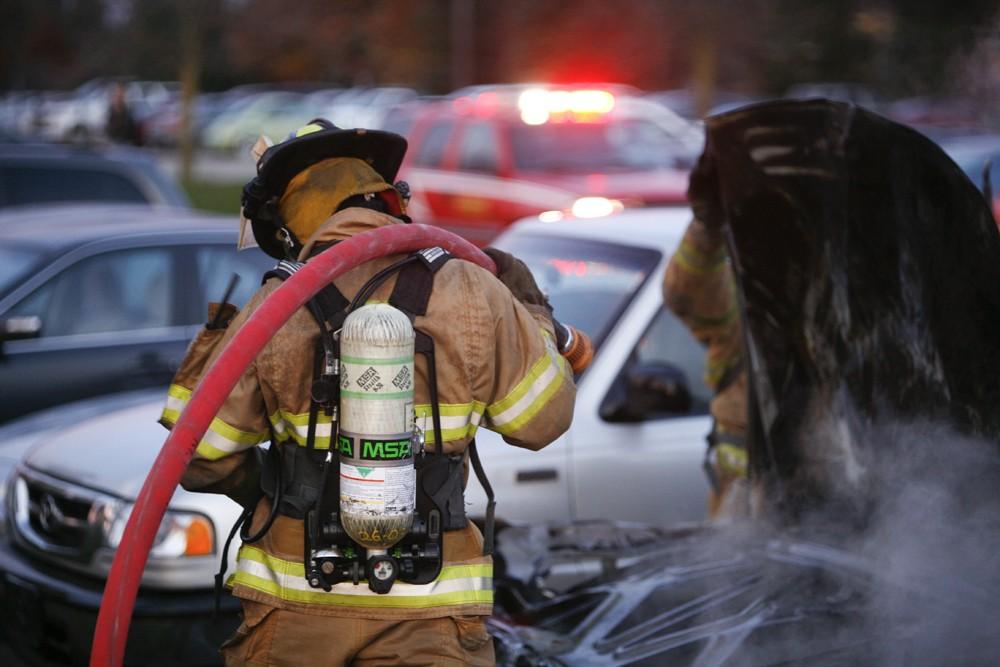 GVL / Eric Coulter
Allendale Fire FIghters responded to a car fire that took place in the parking lot near the Fieldhouse. Grand Valley State Police were unavailable for comment as to the cause of the fire. 