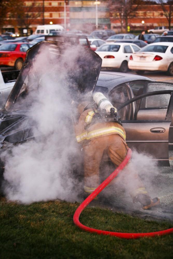 GVL / Eric Coulter
Allendale Fire FIghters responded to a car fire that took place in the parking lot near the Fieldhouse. Grand Valley State Police were unavailable for comment as to the cause of the fire. 