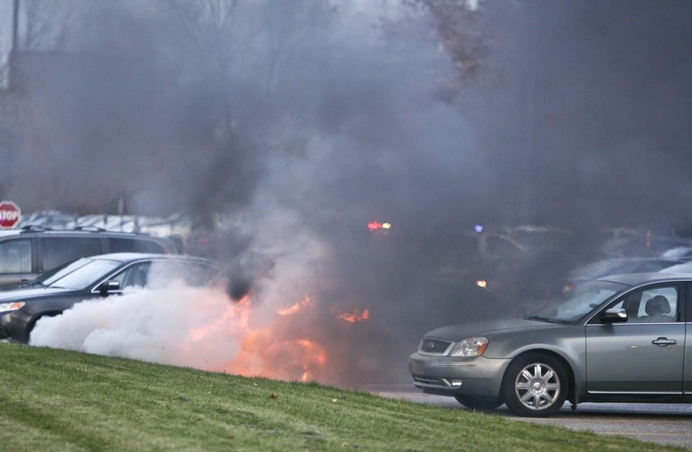 GVL / Eric Coulter
Allendale Fire FIghters responded to a car fire that took place in the parking lot near the Fieldhouse. Grand Valley State Police were unavailable for comment as to the cause of the fire. 