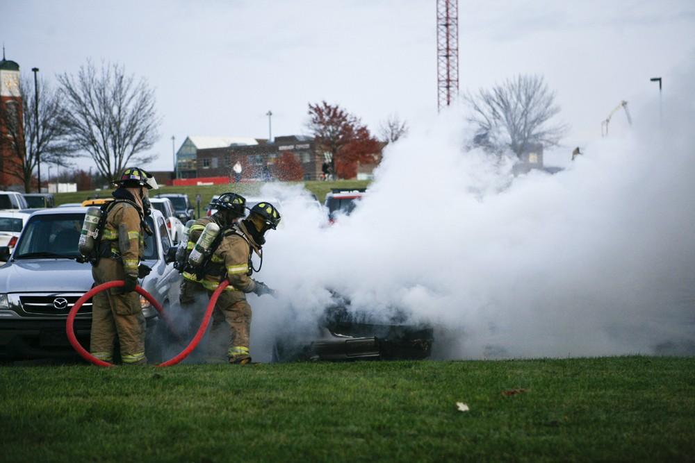 GVL / Eric Coulter
Allendale Fire FIghters responded to a car fire that took place in the parking lot near the Fieldhouse. Grand Valley State Police were unavailable for comment as to the cause of the fire. 