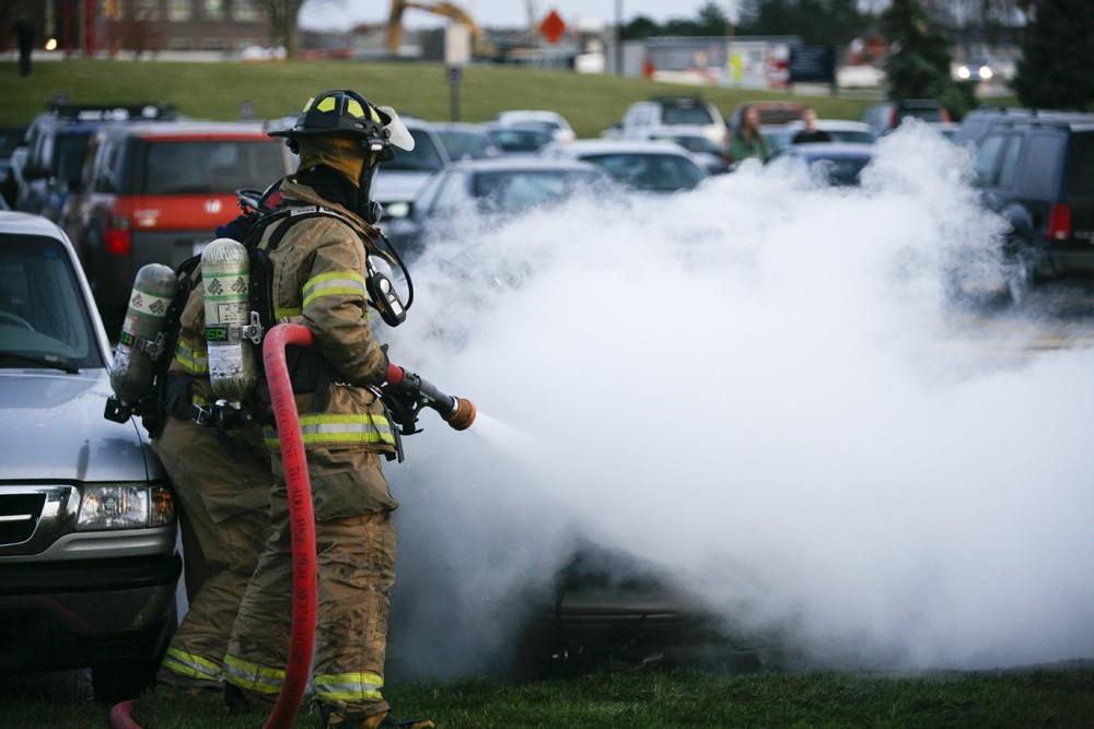 GVL / Eric Coulter
Allendale Fire FIghters responded to a car fire that took place in the parking lot near the Fieldhouse. Grand Valley State Police were unavailable for comment as to the cause of the fire. 