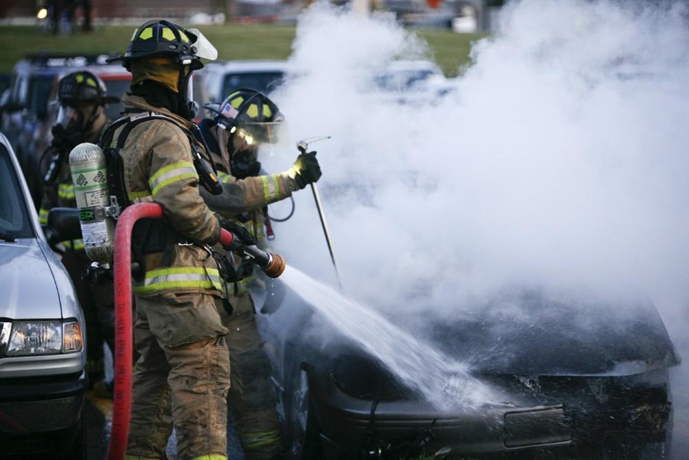 GVL / Eric Coulter
Allendale Fire FIghters responded to a car fire that took place in the parking lot near the Fieldhouse. Grand Valley State Police were unavailable for comment as to the cause of the fire. 