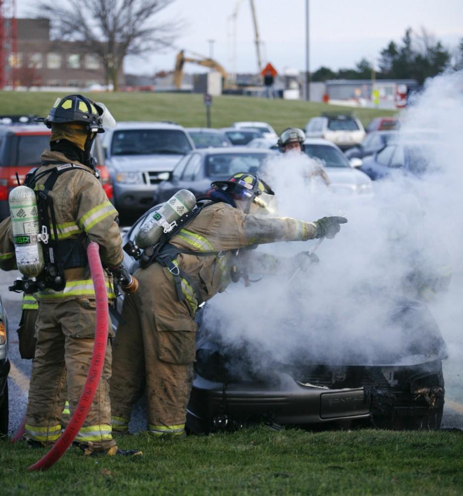 GVL / Eric Coulter
Allendale Fire FIghters responded to a car fire that took place in the parking lot near the Fieldhouse. Grand Valley State Police were unavailable for comment as to the cause of the fire. 