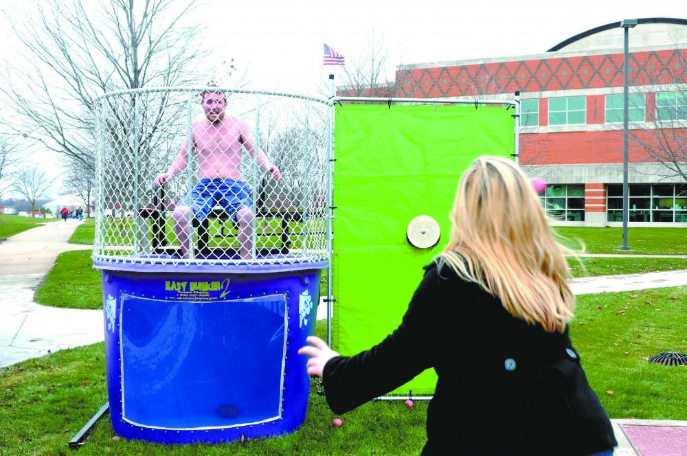 GVL / Eric Coulter
Brennen Gorman braves the cold to help raise money during the Theta Chi fundraiser.