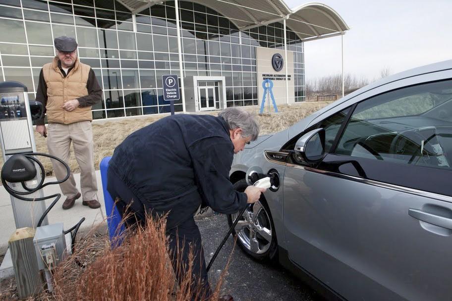 Courtesy Photo / MAREC
MAREC Director Arn Boezaart uses an electric vehicle charging station in Muskegon to charge up a Chevy Volt. GVSU recently installed seven new electric vehicle charging stations in Allendale, Grand Rapids and Muskegon.
