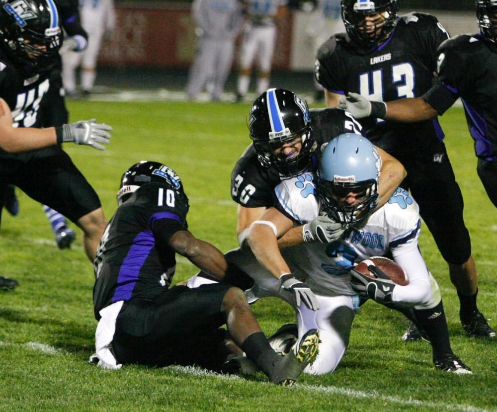GVL ArchiveSenior Zach Breen makes a tackle in last years match. This year the Lakers were victorious 35-10